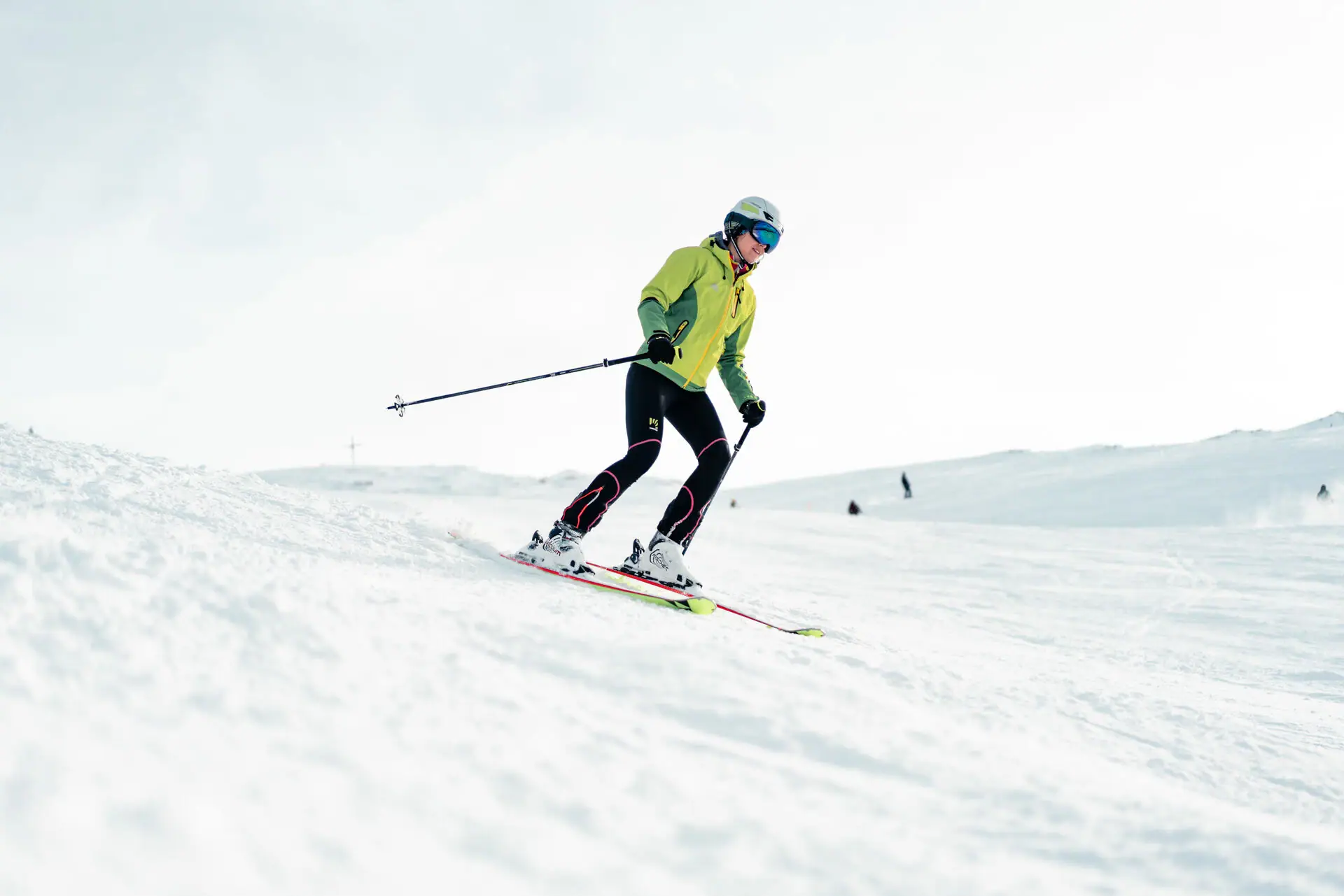 Skiing A person skis down a snowy slope.