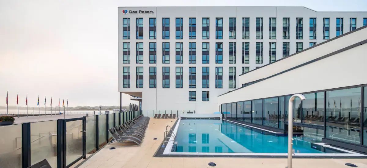 A pool next to a building.