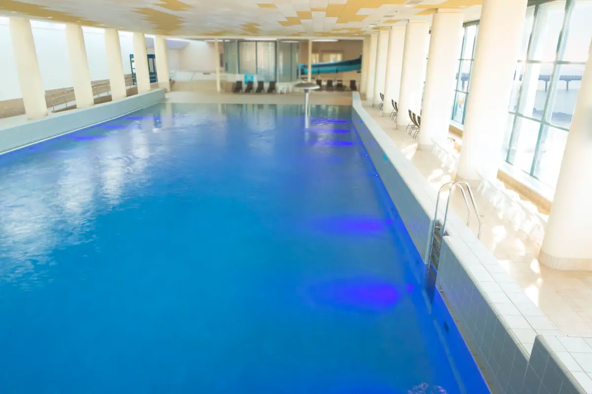 Large indoor pool with clear water.