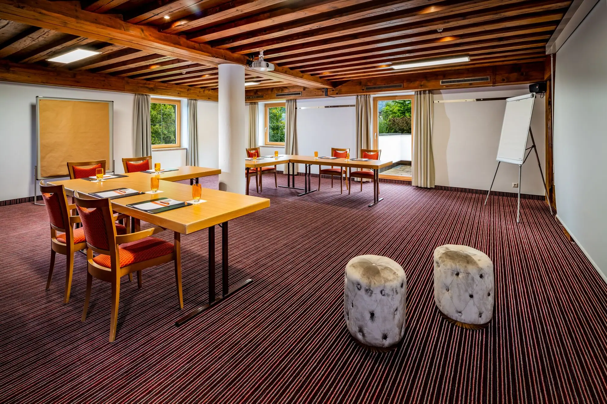 A room with tables and chairs.