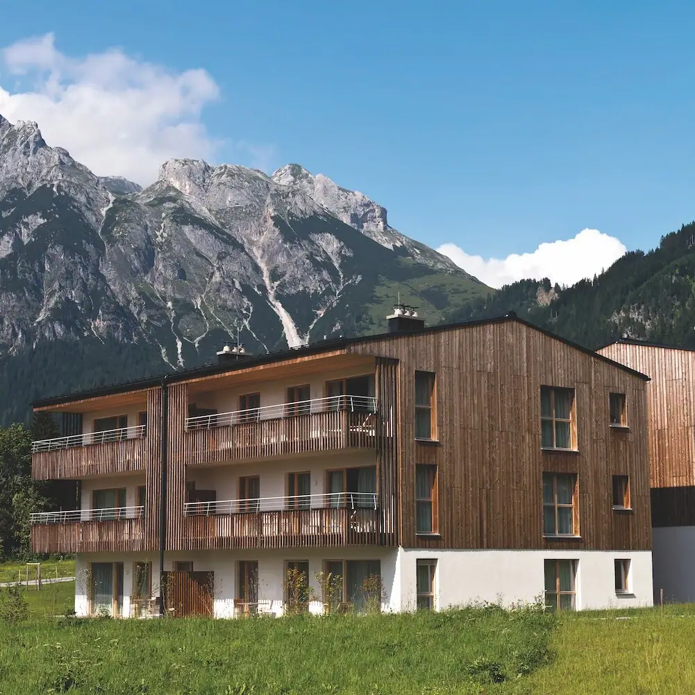 Holiday flats Werfenweng A building with a mountain in the background.