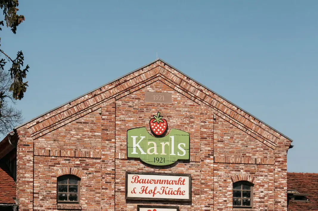 Brick building with signs on the front.