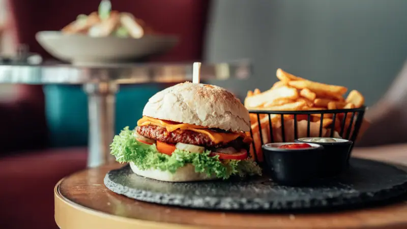 Burger and fries on a table.