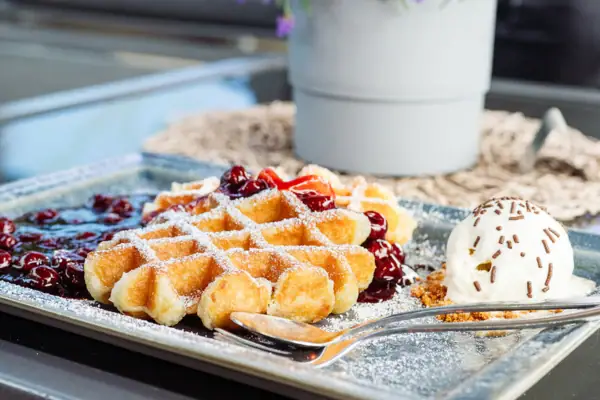Waffles at aja Warnemünde A plate of waffles and ice cream.