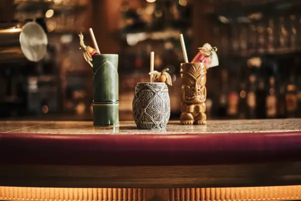 Cocktails at the Rügen Bar A group of tiki mugs on a table