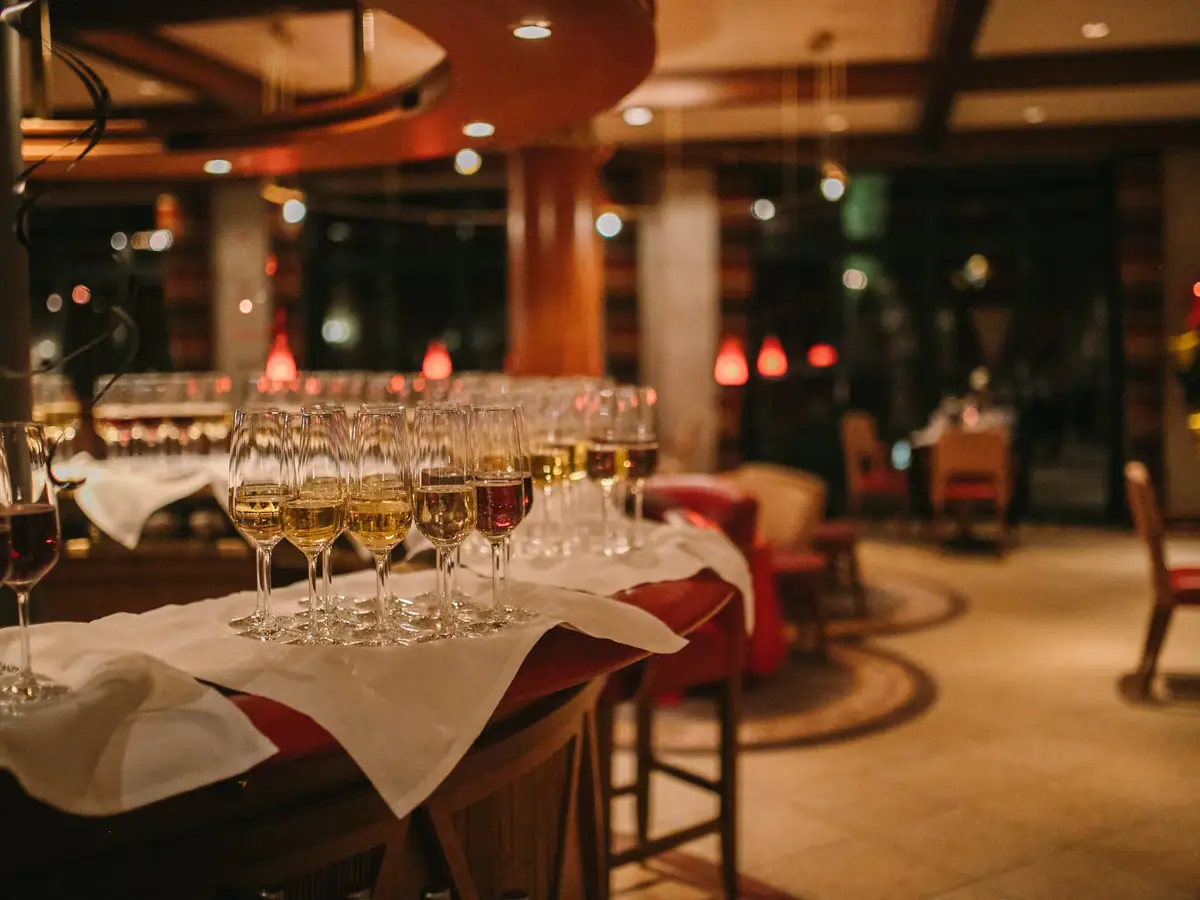 A group of champagne glasses on a table.