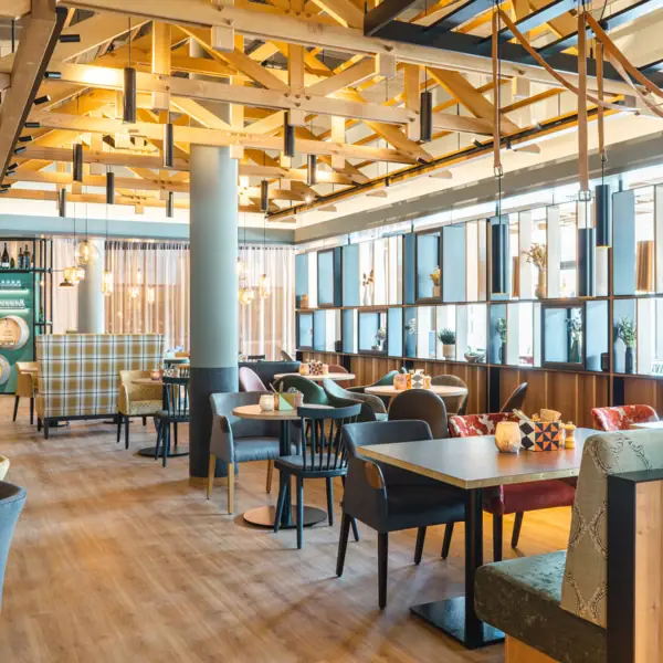 A restaurant with tables and chairs.
