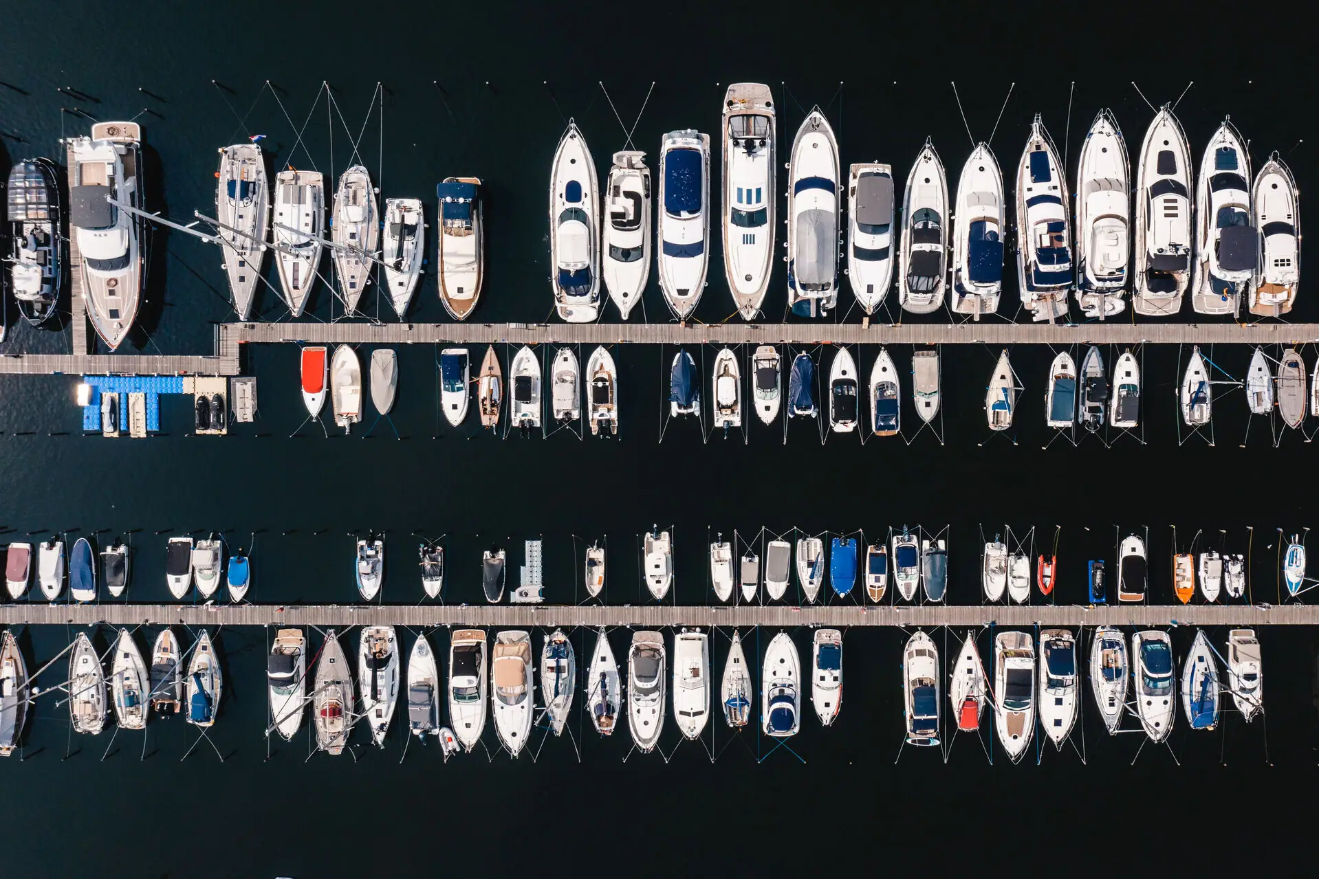 A group of boats at a jetty.