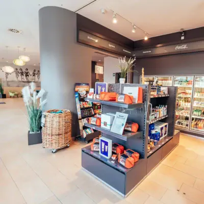 Shelves filled with various goods inside a retail store.