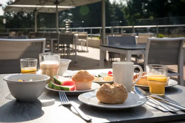 A table with a variety of dishes and crockery.