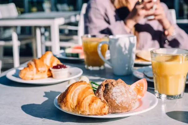 Bread and rolls A plate with breakfast on a table.