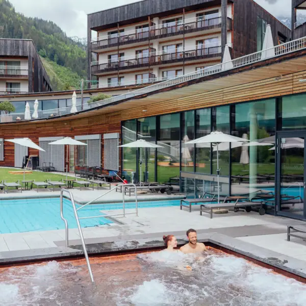 A couple in an outdoor hot tub.