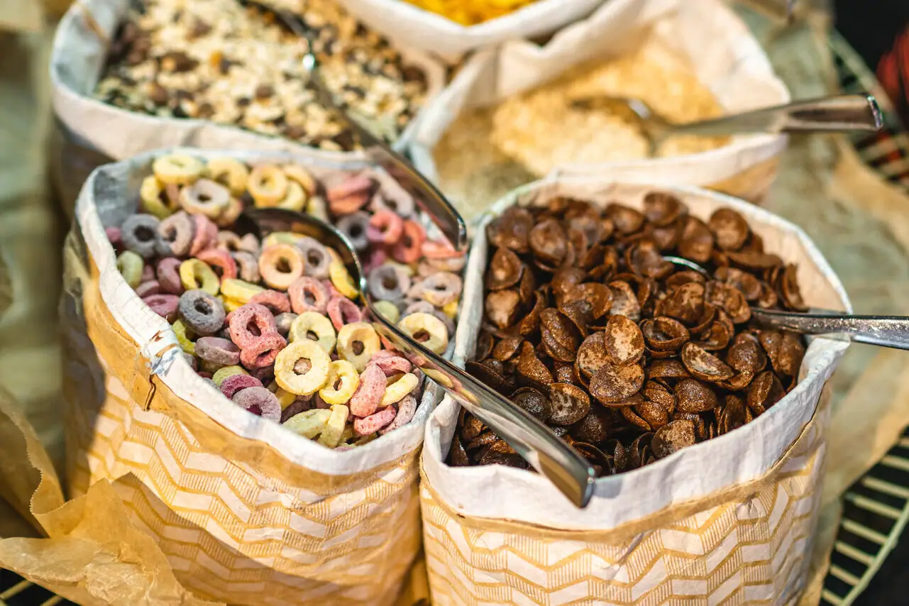 A group of cereal bags with spoons.