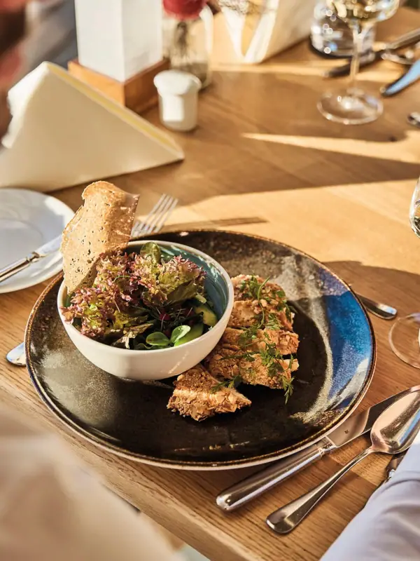 A man eats a meal from a plate.