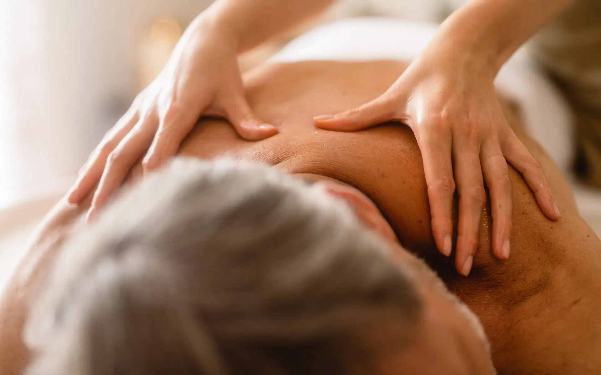 Person receives a back massage.