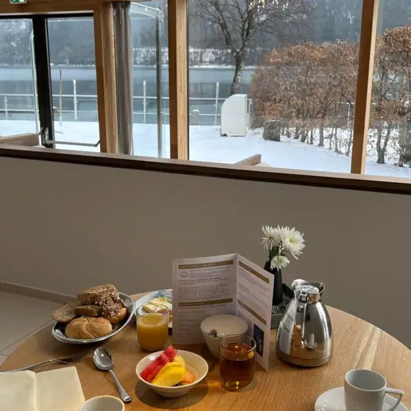 Restaurant in winter A table with food and drinks on it.