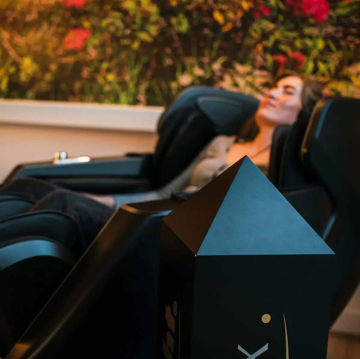 Massage table A woman lies in a massage chair.