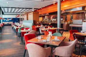 A restaurant with tables and chairs.