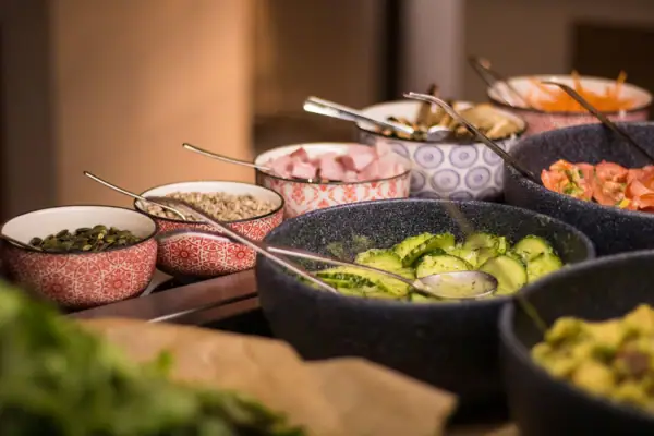 A group of bowls with various dishes.