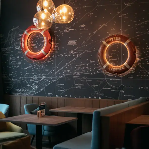 A room with a map and a few lifebuoys.