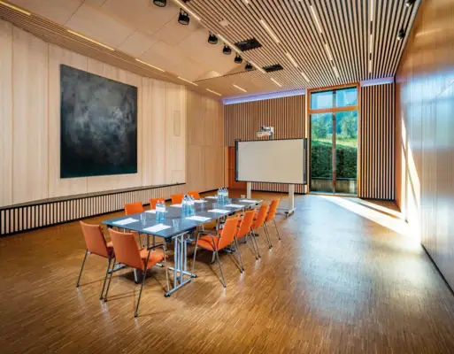 Campus conference room A room with a table and chairs.