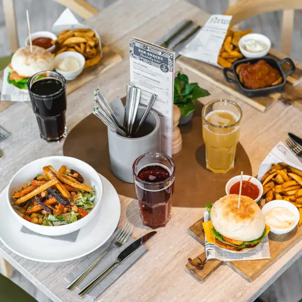 A table with various dishes on it.