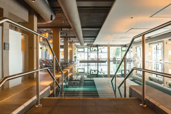 Indoor pool Large indoor pool with stairs and handrail.