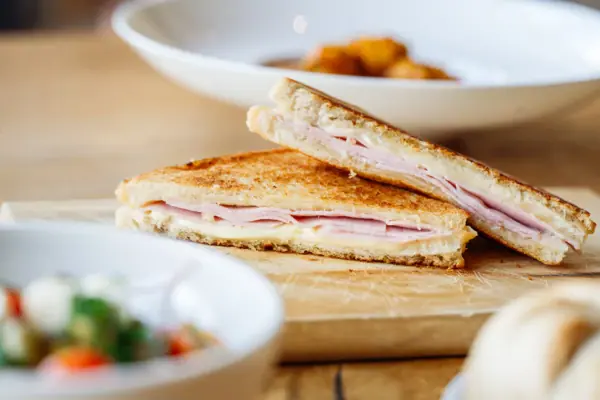 Grilled cheese sandwich on a wooden board