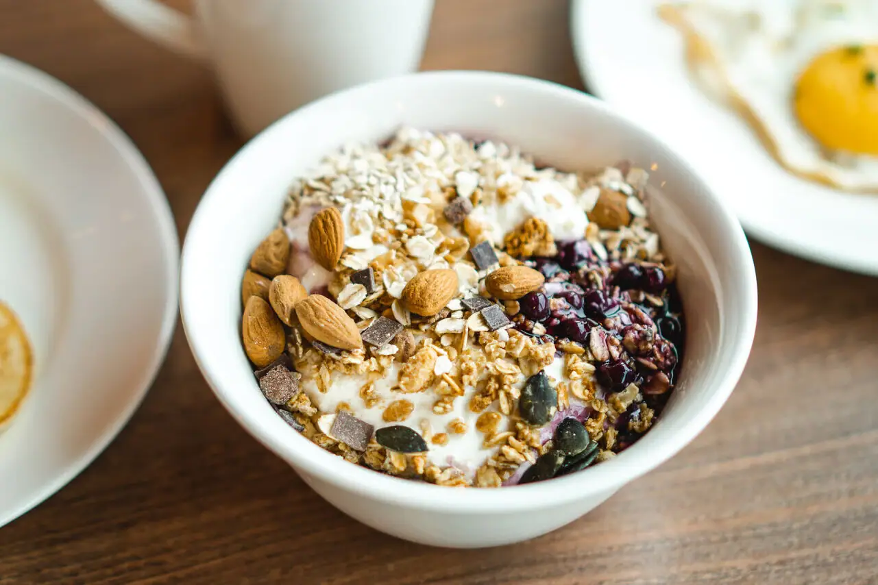 A bowl of food on a table.
