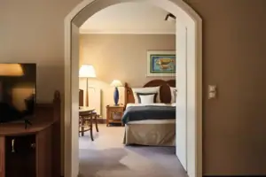 Bedroom with a bed, bedside table and lamp.