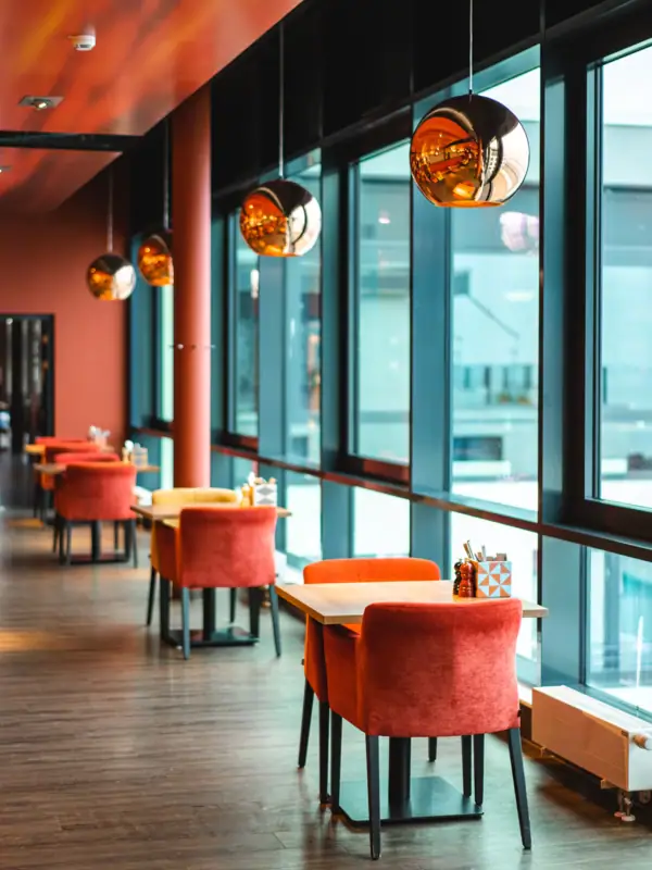 A room with tables and chairs.