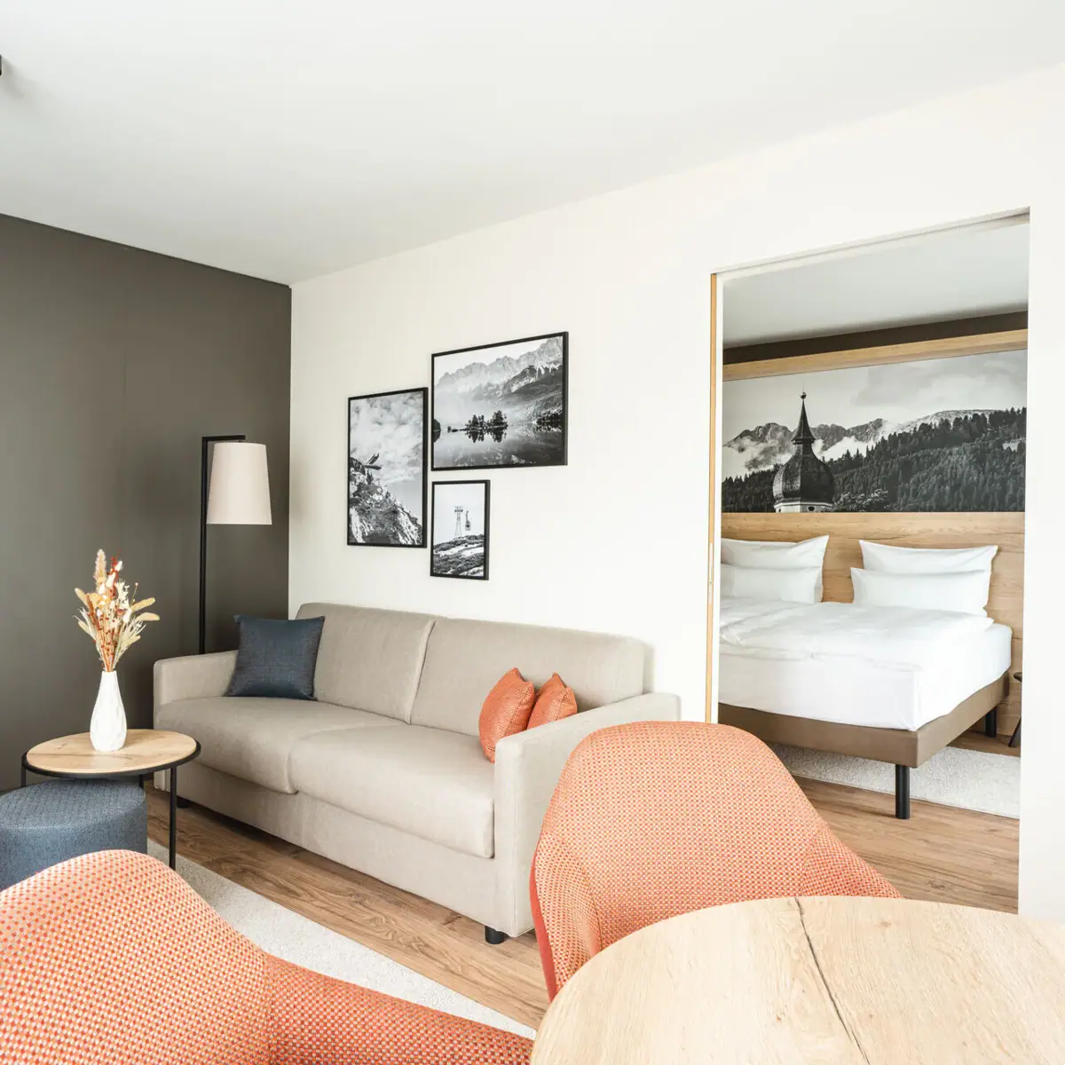 Suite A room with a sofa and a bed.