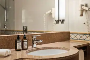 Washbasin with soap dispenser in the bathroom