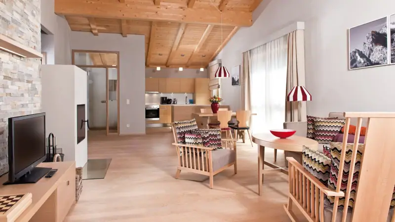 Holiday flat Werfenweng A room with a wooden ceiling and floor.