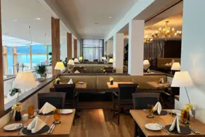 A restaurant with tables and chairs.