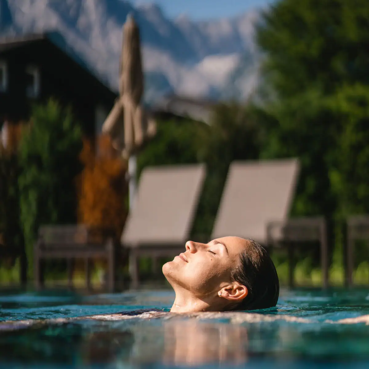 A woman swims in a pool.