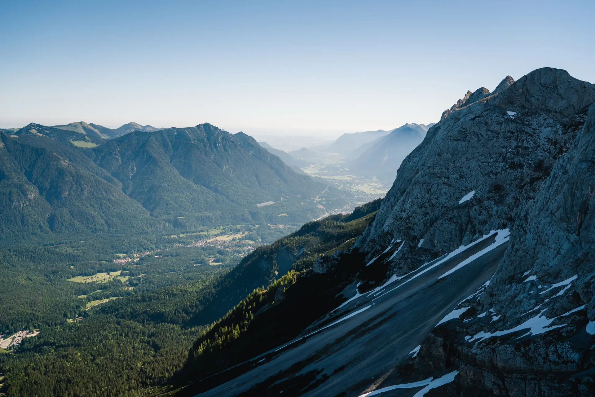 Snow-capped mountain with surrounding trees