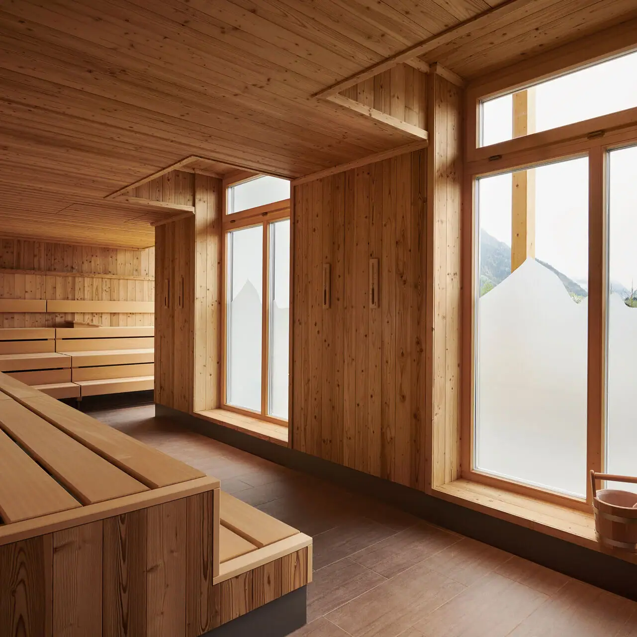 Sauna at aja Ruhpolding A room with a wooden bench and windows.