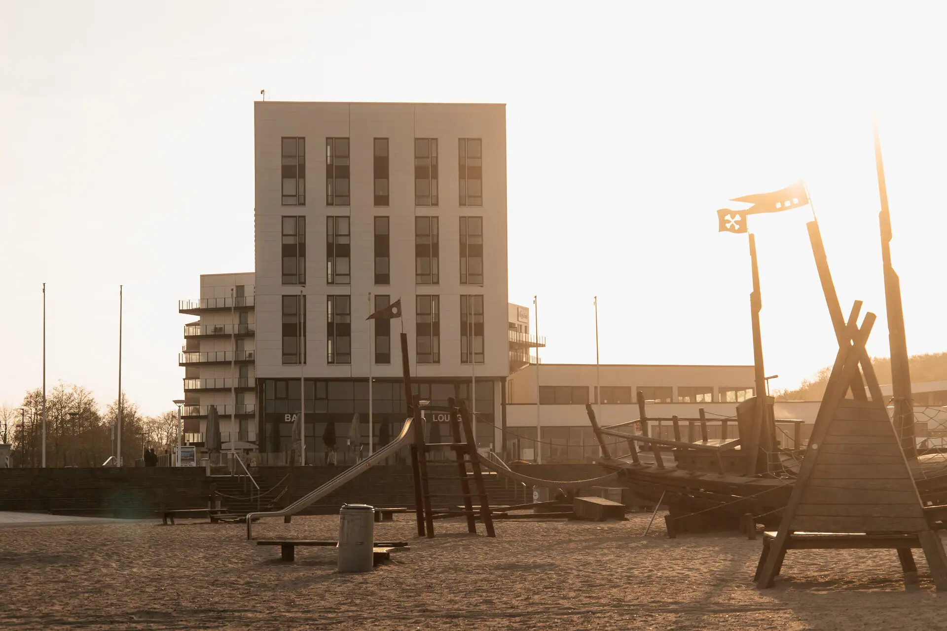 Building with boat and outdoor playground.