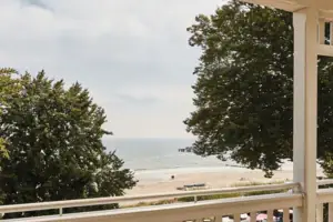 Terrace with chairs and a table on it.