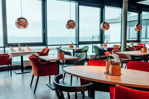 A room with tables and chairs.