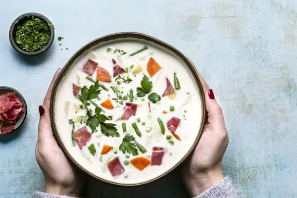 Soup A bowl of soup with vegetables and meat.
