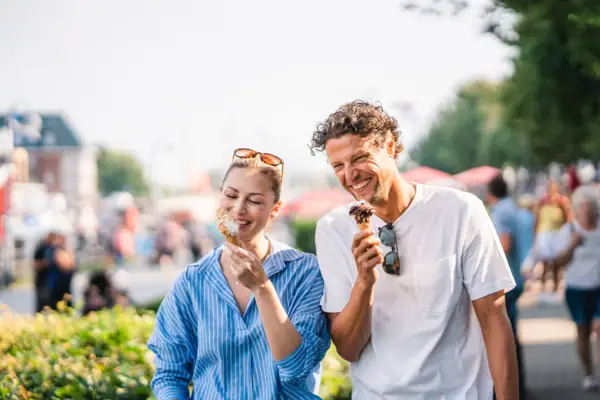 A man and a woman eating ice cream.