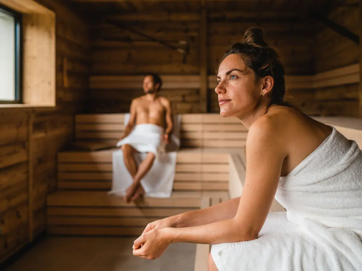 Panorama sauna A woman and a man in a sauna.