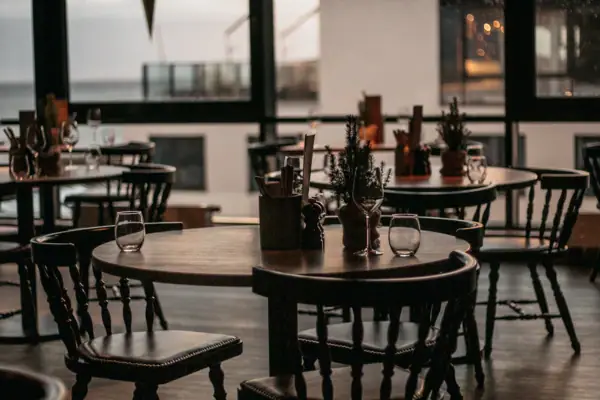 A room with tables and chairs.