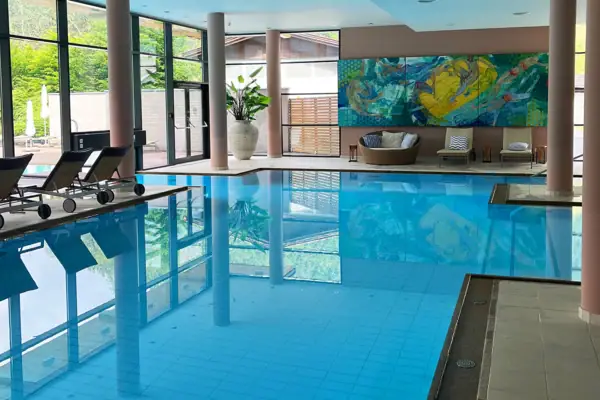 An indoor pool with clear water.