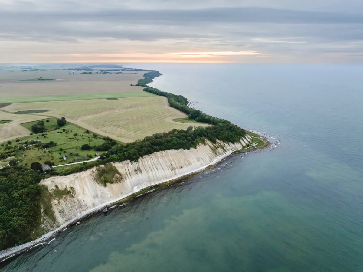 Coastal landscape with water and sky in the background.