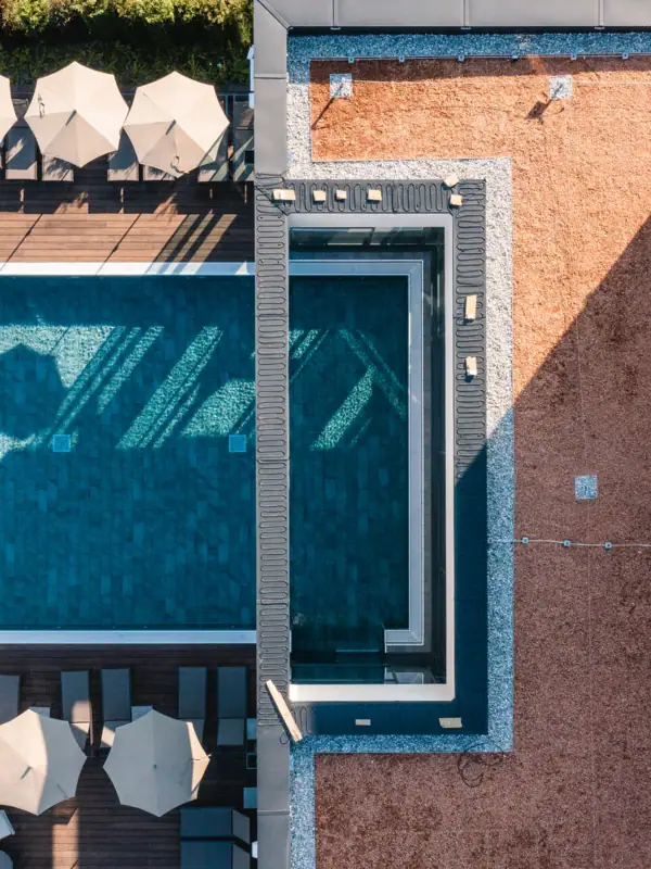 Outdoor pool from above Pool and parasols on one roof