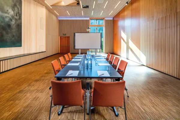 Conference room with table and chairs.