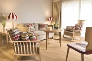 Living room with sofa and chairs.